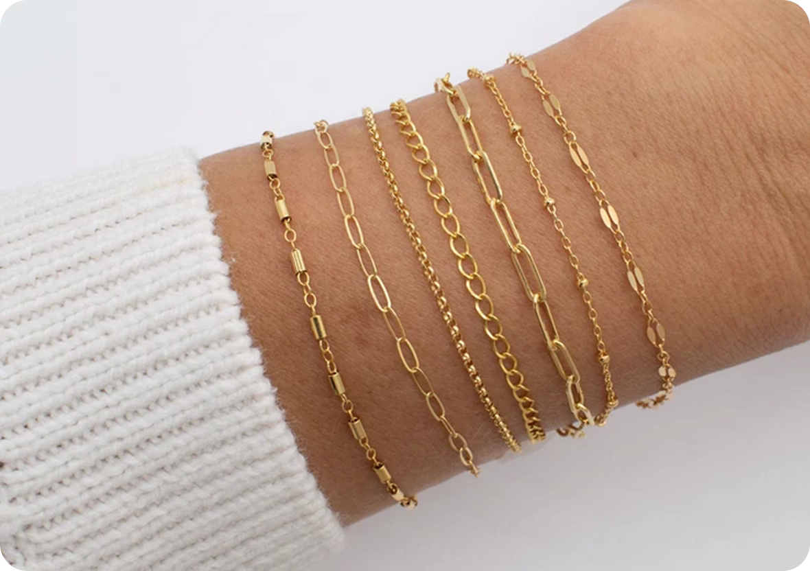 gold chains on the arm, permanent jewelry